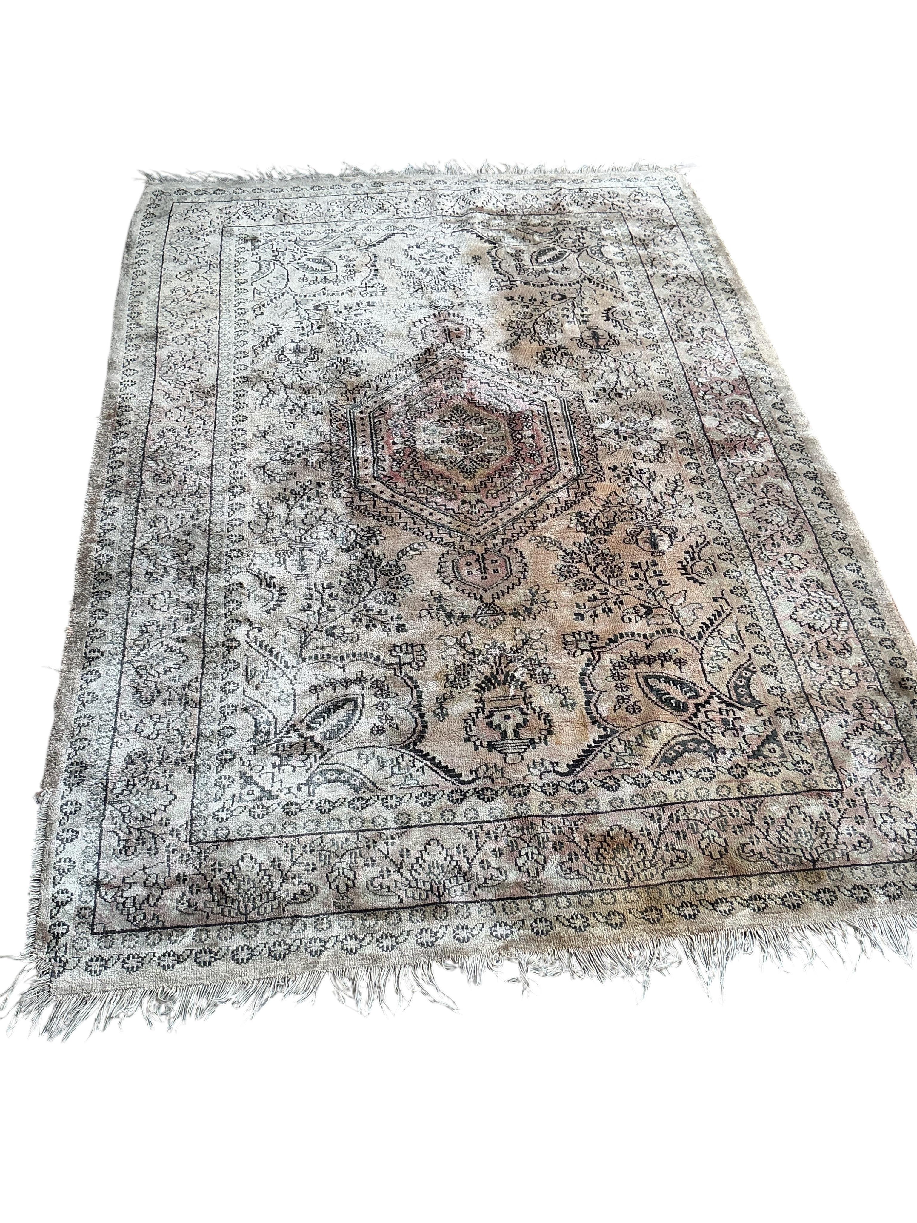 A North West Persian peach ground part silk rug and a Caucasian style rug, larger 175 x 126cm